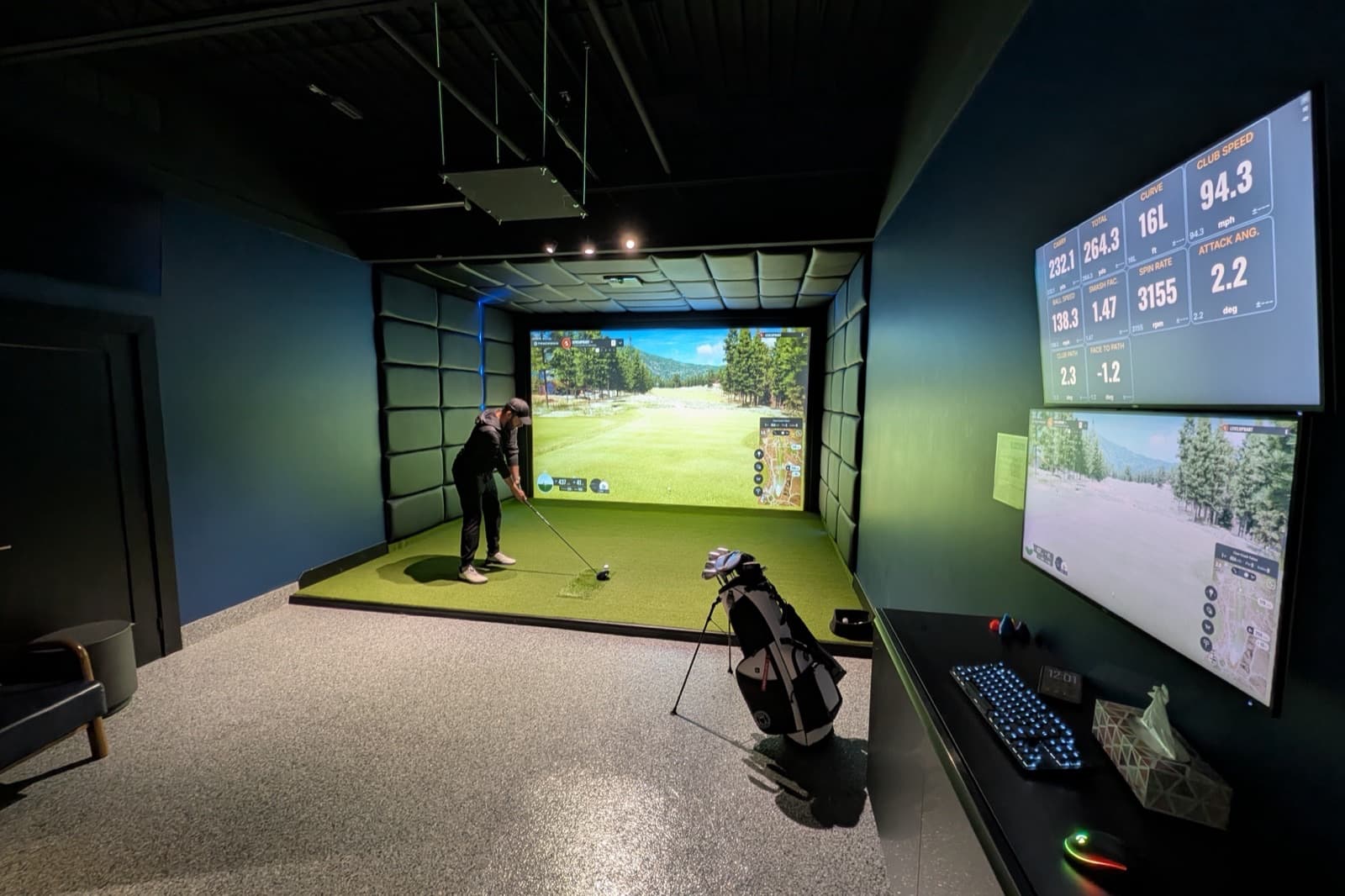 Bart at address in a private Trackman iO bay at LevelUp Indoor Golf in Stoney Creek, the launch monitor showing live club and ball data