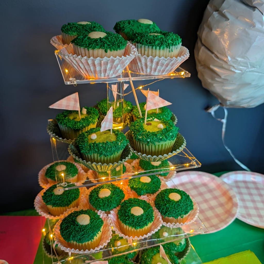 Golf-themed birthday cupcake tower at LevelUp Indoor Golf